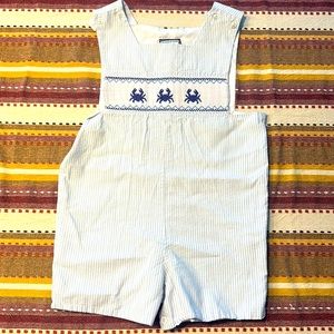 Boys seersucker smocked crab shortall.